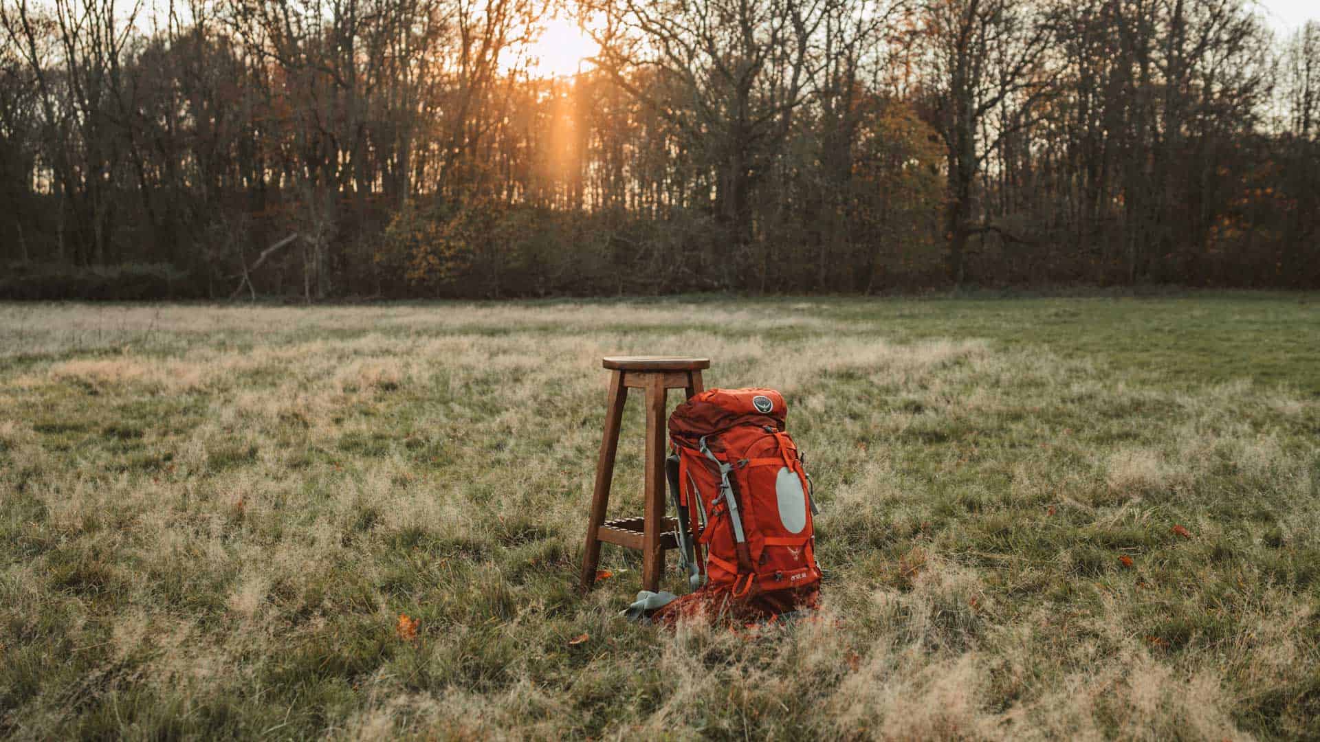 give and grow backpack red field sunshine sunset